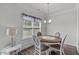 Bright dining area with four chairs and a table, complemented by natural light at 87 S Cousins Ct, Smithfield, NC 27577