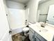 Clean bathroom featuring a shower-tub combo, toilet, and sink with vanity at 156 Southern Estates Dr, Sanford, NC 27330