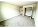 Spacious bedroom with neutral walls and plush carpeting and a closet at 156 Southern Estates Dr, Sanford, NC 27330