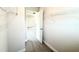 View from closet into the bedroom with wire shelves on the walls at 156 Southern Estates Dr, Sanford, NC 27330