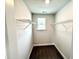 Walk-in closet with wire shelving and a window for natural light at 156 Southern Estates Dr, Sanford, NC 27330