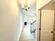 Inviting entryway with view of the living room and staircase at 156 Southern Estates Dr, Sanford, NC 27330