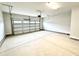 Spacious two-car garage with smooth concrete flooring and white door at 156 Southern Estates Dr, Sanford, NC 27330