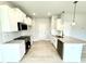 Modern kitchen featuring granite countertops and stainless steel appliances at 156 Southern Estates Dr, Sanford, NC 27330