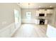Eat-in kitchen featuring modern appliances, granite countertops, and white cabinetry at 156 Southern Estates Dr, Sanford, NC 27330