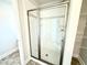 Shower with a glass door and white subway tile surround at 156 Southern Estates Dr, Sanford, NC 27330