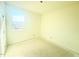 Simple bedroom with a window and neutral walls at 38 Longdale Dr, Graham, NC 27253