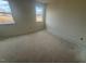 Bright bedroom with two windows and neutral walls at 38 Longdale Dr, Graham, NC 27253