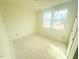 Bedroom with two windows and neutral walls at 38 Longdale Dr, Graham, NC 27253