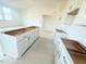 Kitchen island with white cabinets and drawers at 38 Longdale Dr, Graham, NC 27253