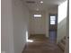 Bright entryway showcasing wood-look flooring and a view into the home's open-concept living space at 39 Longdale Dr, Graham, NC 27253