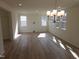 Open living room featuring light wood floors, recessed lighting, and abundant natural light from multiple windows at 39 Longdale Dr, Graham, NC 27253