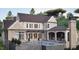 The back of this brick and siding home features a swimming pool and outdoor covered dining area at 4812 Parker Meadow Dr, Raleigh, NC 27614