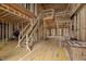 Unfinished living room with staircase, featuring wood framing and subfloors at 4812 Parker Meadow Dr, Raleigh, NC 27614