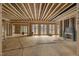 Spacious living area under construction with exposed wood framing and multiple doorways at 4812 Parker Meadow Dr, Raleigh, NC 27614