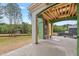 Picturesque outdoor living space featuring a fireplace and views of the lush backyard at 4812 Parker Meadow Dr, Raleigh, NC 27614