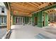 An under-construction outdoor living space with exposed beams, green sheathing, and french door, showing potential and design at 4812 Parker Meadow Dr, Raleigh, NC 27614