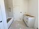 Bright bathroom featuring a white tiled shower-tub combo and vanity being installed at 5208 Knollwood Rd, Raleigh, NC 27609