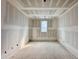 Unfinished bedroom with large window in new construction at 5208 Knollwood Rd, Raleigh, NC 27609