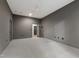 Spacious bedroom with gray walls, carpet, and an open glass door at 5208 Knollwood Rd, Raleigh, NC 27609