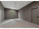 Empty bedroom with gray walls, carpet, a window, a ceiling fan, and dark trim at 5208 Knollwood Rd, Raleigh, NC 27609