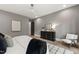 Comfortable bedroom with neutral decor, sleek furnishings, and ample natural light from the window at 5208 Knollwood Rd, Raleigh, NC 27609