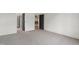 Bedroom with neutral carpet, an open closet, and doorway views into other rooms at 5208 Knollwood Rd, Raleigh, NC 27609
