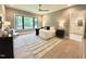 Bright bedroom with a large window and a neutral color palette creating a peaceful and relaxing atmosphere at 5208 Knollwood Rd, Raleigh, NC 27609