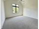 Spacious bedroom with neutral carpet, natural light and ample closet space for comfortable living at 5208 Knollwood Rd, Raleigh, NC 27609