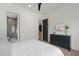 Comfortable bedroom showing a dark dresser, an ensuite bathroom and a calming atmosphere at 5208 Knollwood Rd, Raleigh, NC 27609