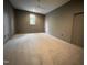 Spacious bedroom with neutral carpet, natural light, and ample closet space for comfortable living at 5208 Knollwood Rd, Raleigh, NC 27609