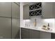 Butler pantry area with extra cabinetry, counter space, and wine storage at 5208 Knollwood Rd, Raleigh, NC 27609