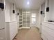 Expansive walk-in closet featuring custom storage solutions, including shelving and drawers at 5208 Knollwood Rd, Raleigh, NC 27609