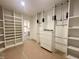 Spacious walk-in closet with custom shelving and ample storage space for organization at 5208 Knollwood Rd, Raleigh, NC 27609