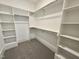 Walk-in closet featuring ample storage space with multiple shelves and metal rails at 5208 Knollwood Rd, Raleigh, NC 27609