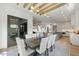 Open concept dining area with wood floors, modern lighting, and easy access to a fully equipped kitchen at 5208 Knollwood Rd, Raleigh, NC 27609