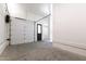 A well-lit garage with a white door, a clean concrete floor, and entry door at 5208 Knollwood Rd, Raleigh, NC 27609