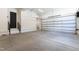 Spacious garage with clean, concrete floors and modern lighting at 5208 Knollwood Rd, Raleigh, NC 27609