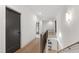 Bright hallway with hardwood floors and modern lighting connecting various rooms in the home at 5208 Knollwood Rd, Raleigh, NC 27609