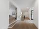 Spacious hallway with hardwood floors and staircase, offering a glimpse into the living spaces at 5208 Knollwood Rd, Raleigh, NC 27609