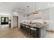 Modern kitchen with a large center island, pendant lighting, and sleek countertops at 5208 Knollwood Rd, Raleigh, NC 27609