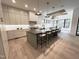 Spacious kitchen featuring stainless steel appliances, modern cabinetry, and a large center island at 5208 Knollwood Rd, Raleigh, NC 27609