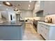 Sleek kitchen showcasing stone countertops, a stainless steel range, and elegant cabinetry at 5208 Knollwood Rd, Raleigh, NC 27609