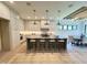 Bright kitchen boasts ample counter space, modern lighting, and an adjacent dining area at 5208 Knollwood Rd, Raleigh, NC 27609