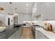 Stylish kitchen featuring modern appliances, white cabinets, and marble countertops at 5208 Knollwood Rd, Raleigh, NC 27609