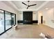 Bright, spacious living room with modern fireplace, sleek cabinets, and large windows for ample natural light at 5208 Knollwood Rd, Raleigh, NC 27609
