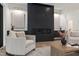 Stylish living room featuring a stone-look fireplace with mantel and built-in storage, plus bright furniture at 5208 Knollwood Rd, Raleigh, NC 27609