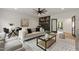 Comfortable living room with modern decor, fireplace, and ample seating for relaxation and entertainment at 5208 Knollwood Rd, Raleigh, NC 27609
