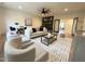 Open-concept living area featuring stylish furniture, hardwood floors, and a functional beverage bar at 5208 Knollwood Rd, Raleigh, NC 27609