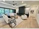 Bright living room with ample seating around a fireplace at 5208 Knollwood Rd, Raleigh, NC 27609
